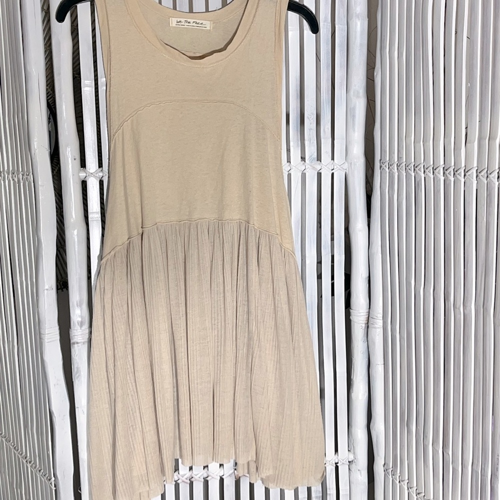 We The Free dress slightly see through on bottom with long open sleeve holes.